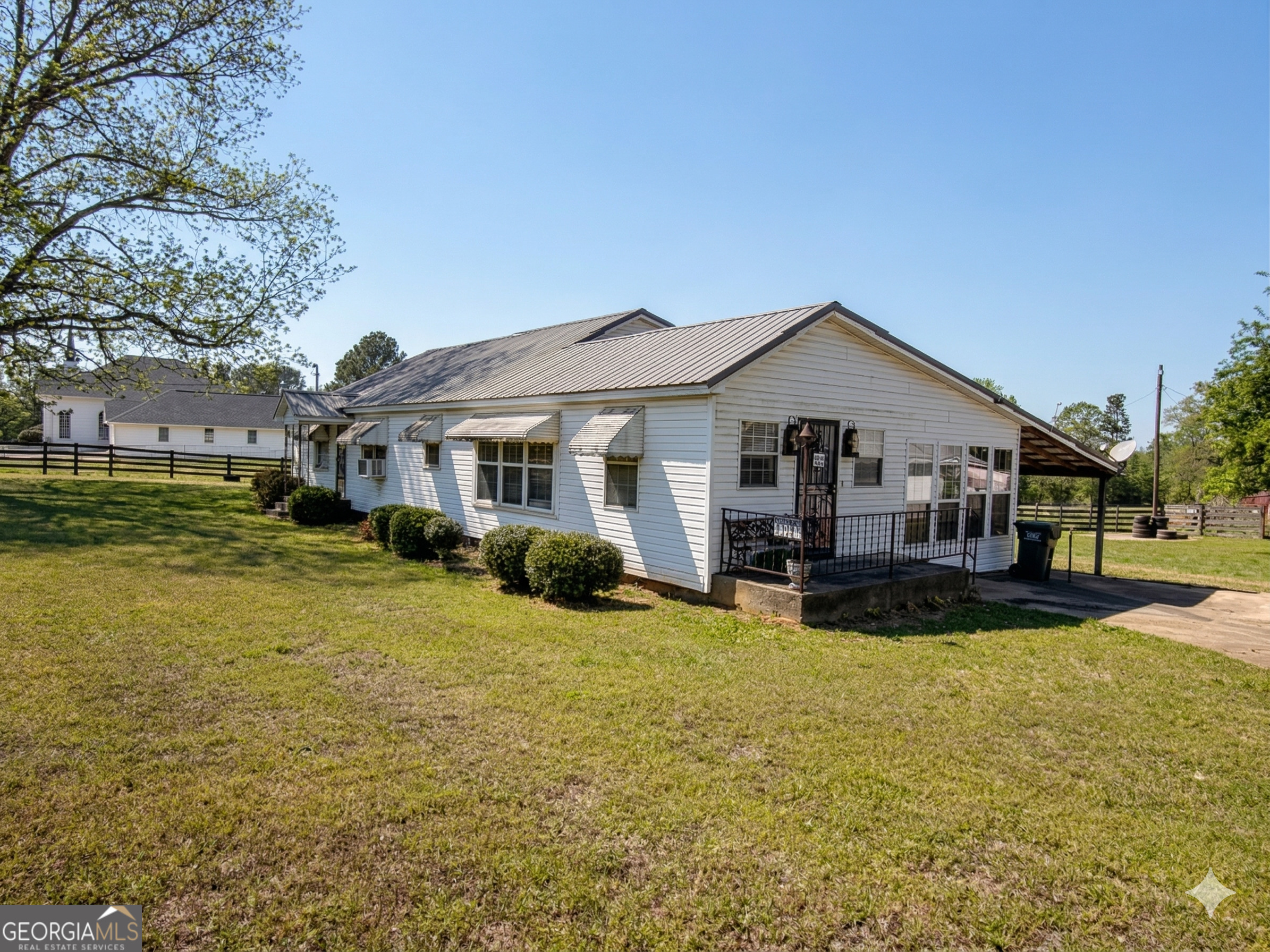 32737 Highway 48 Graham, AL 36263 - Photo 4 of 69 a front view of a house with swimming pool having outdoor seating