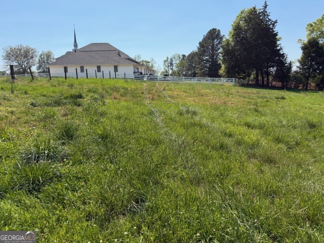 32737 Highway 48 Graham, AL 36263 - Photo 66 of 69 a view of a big house with a big yard and large trees
