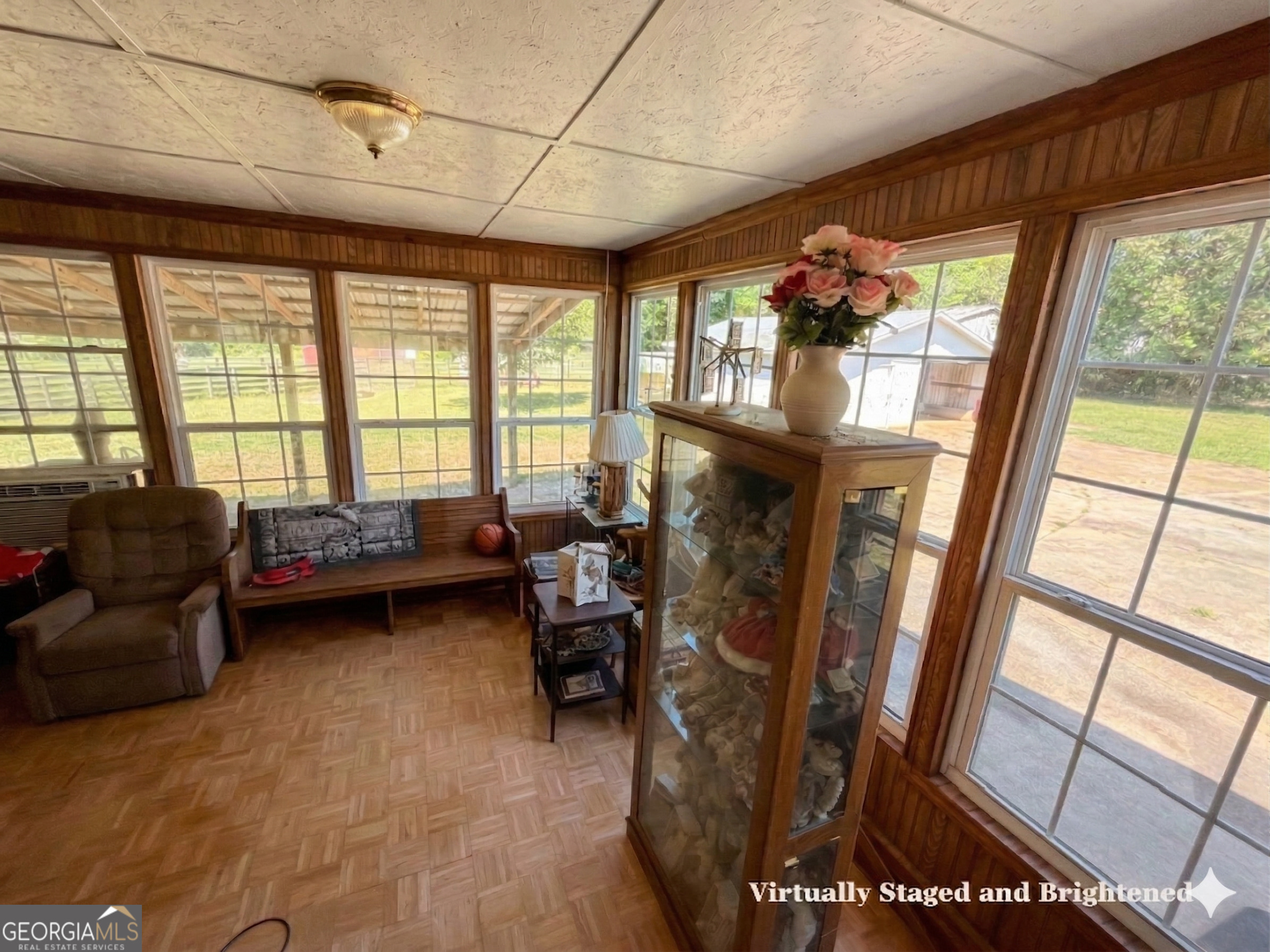 32737 Highway 48 Graham, AL 36263 - Photo 8 of 69 a living room with furniture and a floor to ceiling window