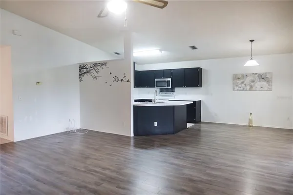 a view of kitchen with wooden floor