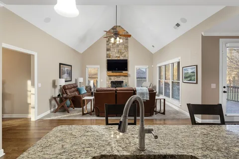 a view of a livingroom with furniture window and wooden floor