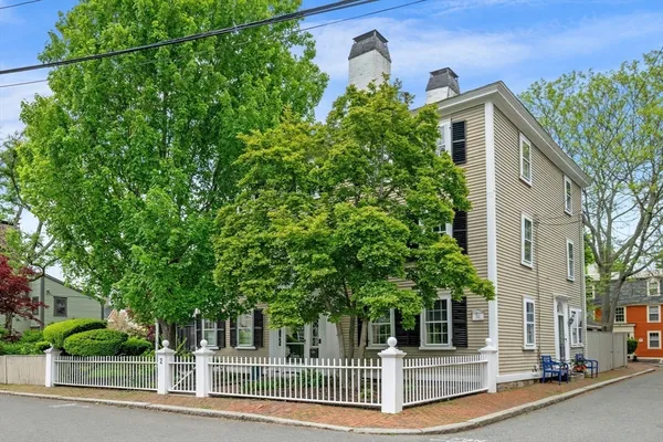 a view of a house with a tree