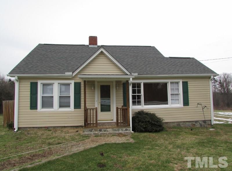 414 McGhees Mill Road Roxboro, NC 27574 - Photo 1 of 22 a view of a house with a yard