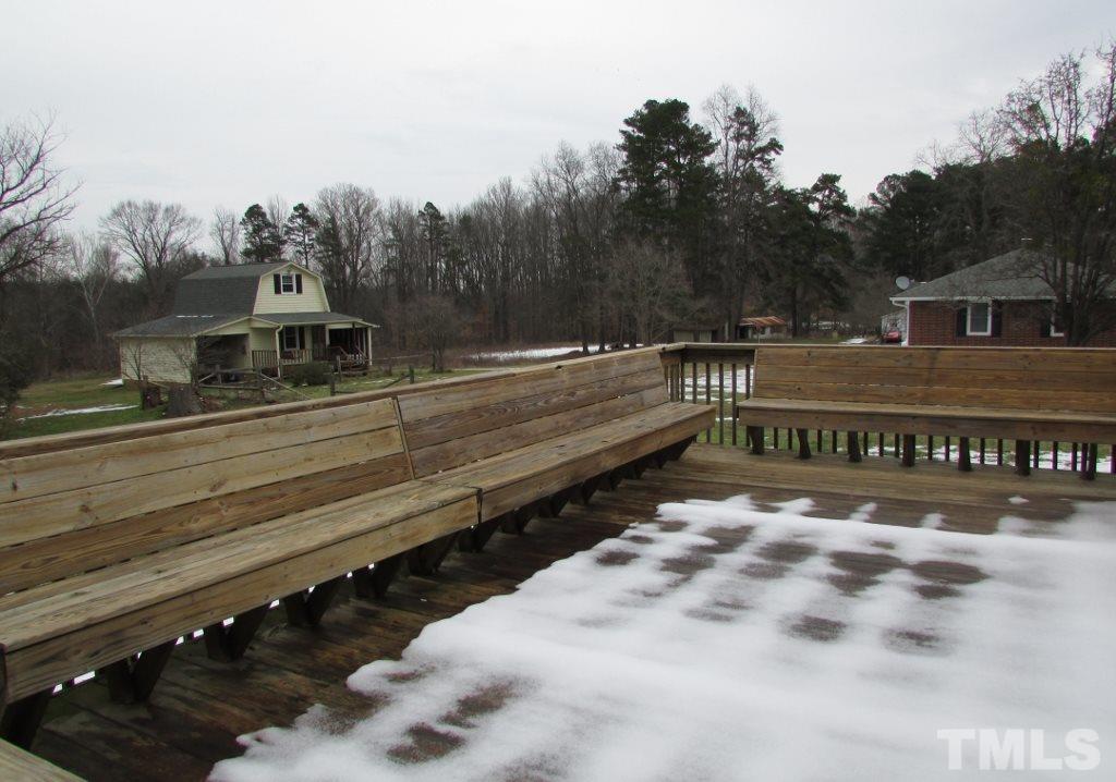 414 McGhees Mill Road Roxboro, NC 27574 - Photo 17 of 22 a view of a street with a car park in front of the house