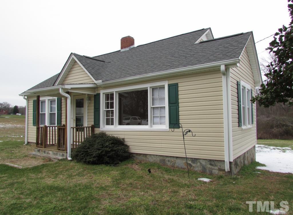 414 McGhees Mill Road Roxboro, NC 27574 - Photo 2 of 22 a view of a house with a yard
