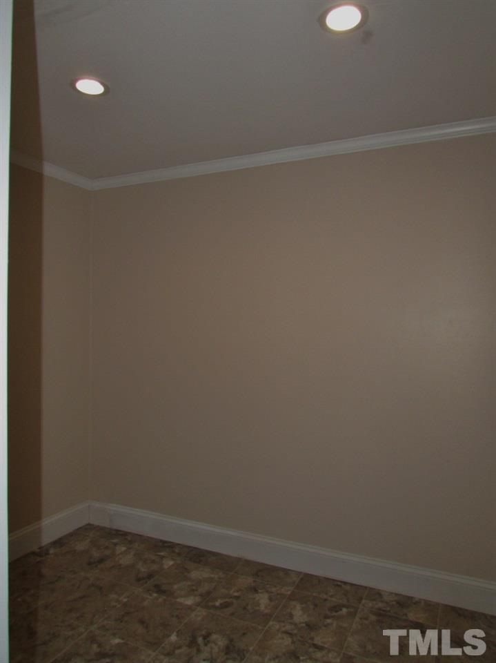 414 McGhees Mill Road Roxboro, NC 27574 - Photo 10 of 22 a view of small space with racks on the wall