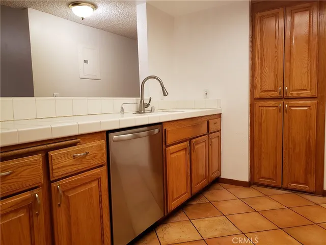 a view of a sink storage and utility room with a sink