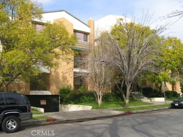 a view of a car parked in front of a building