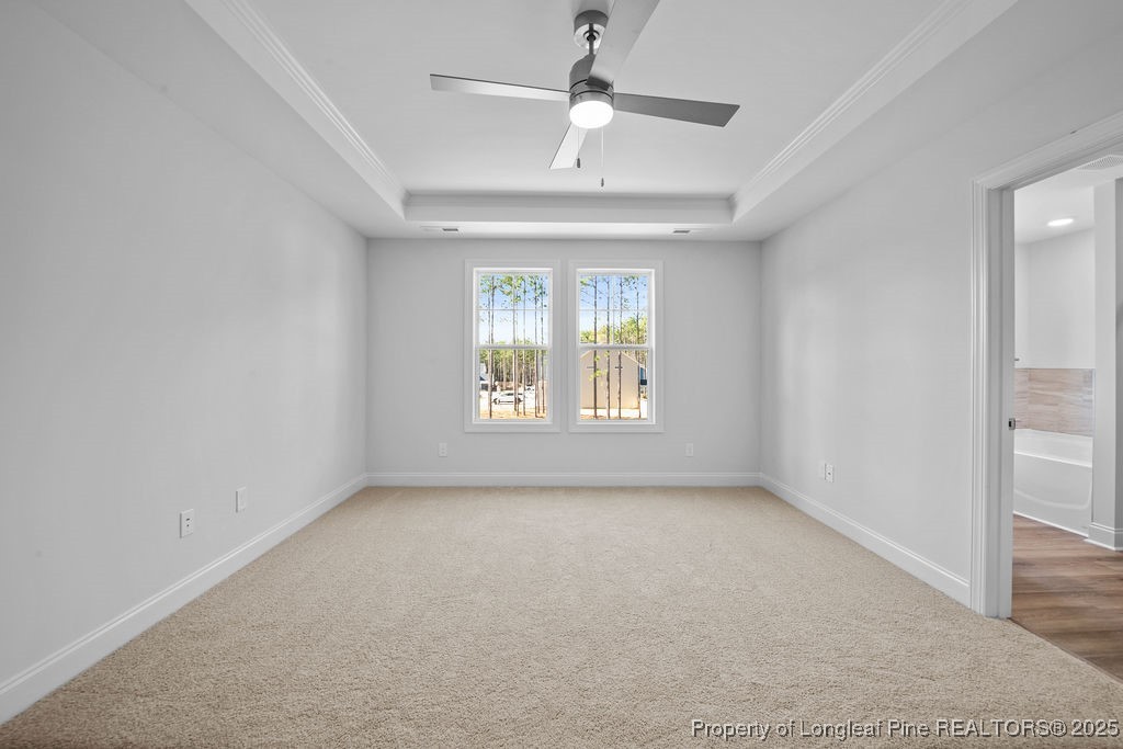 1004 Rhum Drive Fayetteville, NC 28311 - Photo 17 of 34 an empty room with a window and a ceiling fan