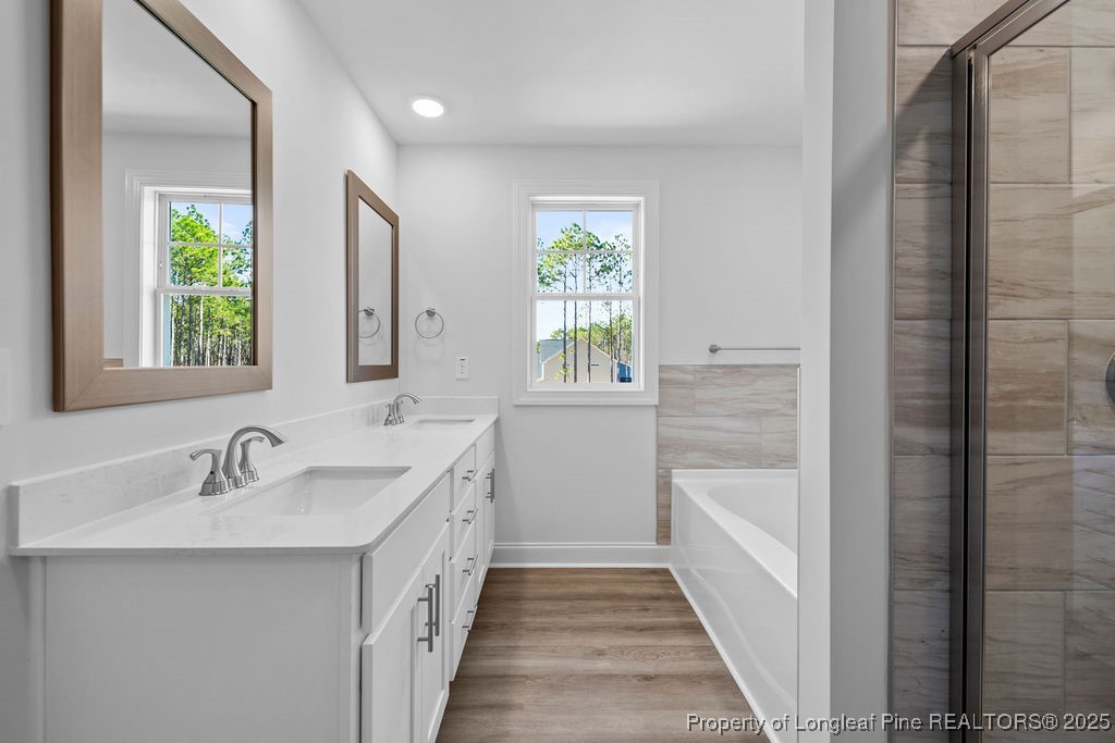1004 Rhum Drive Fayetteville, NC 28311 - Photo 19 of 34 a bathroom with a double vanity sink and a window