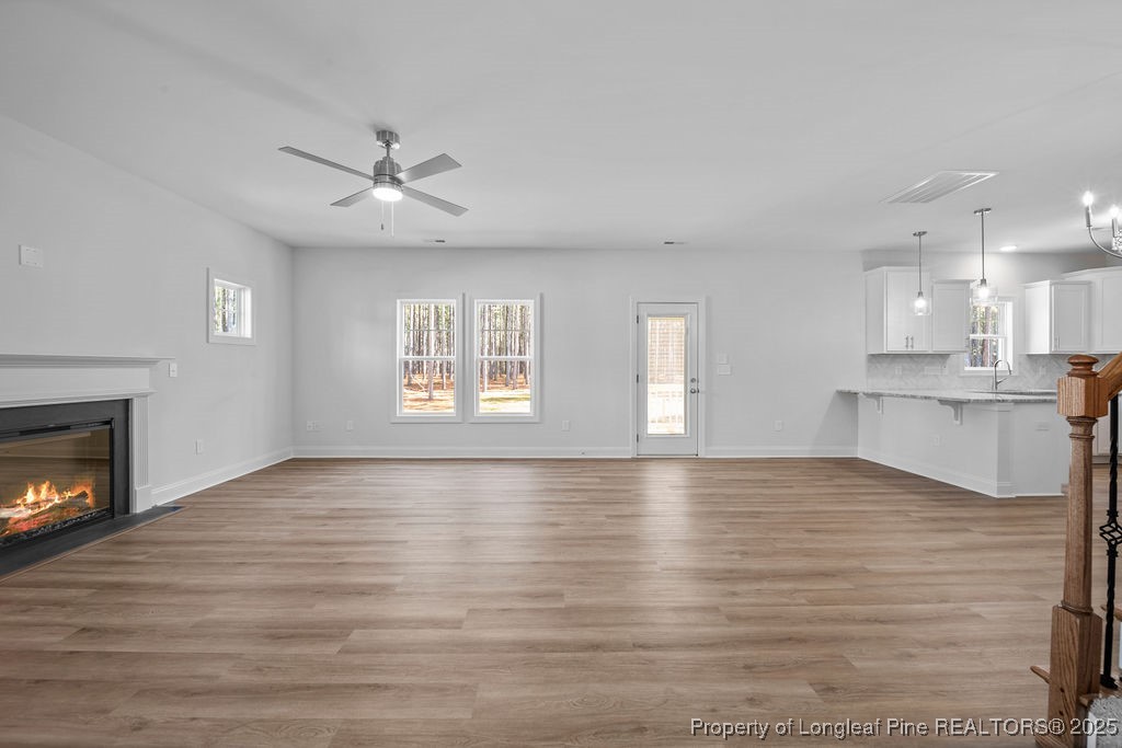 1004 Rhum Drive Fayetteville, NC 28311 - Photo 6 of 34 a view of an empty room with window and wooden floor