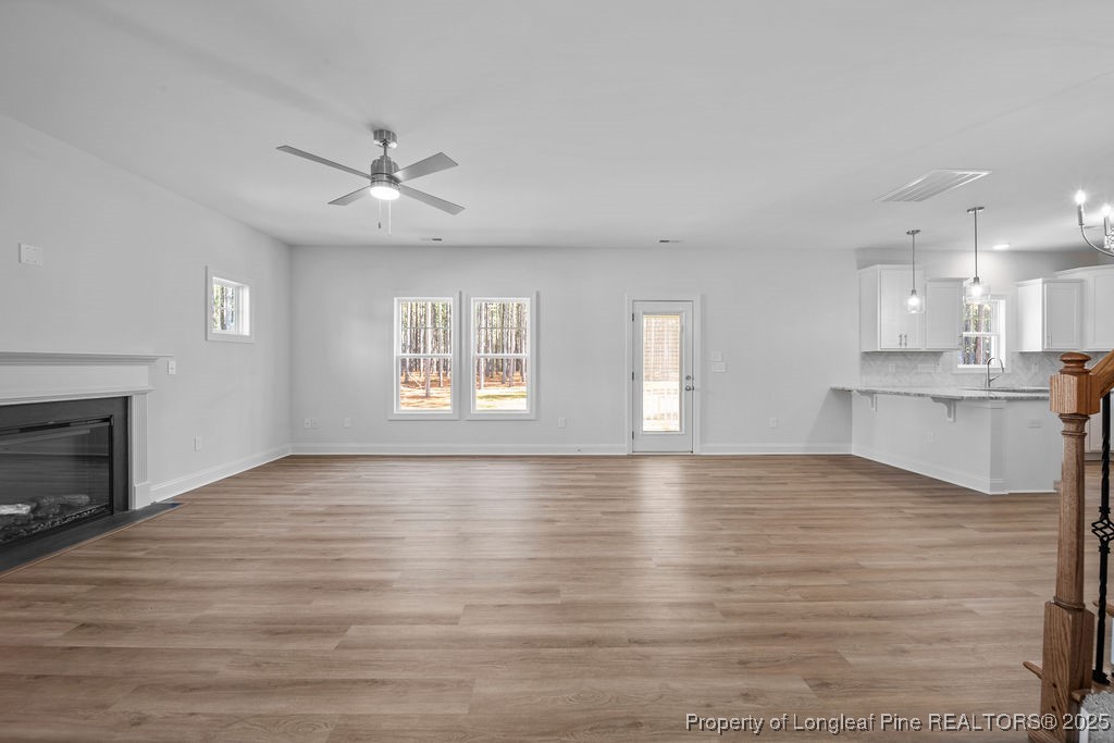 1004 Rhum Drive Fayetteville, NC 28311 - Photo 7 of 34 a view of an empty room with window and wooden floor