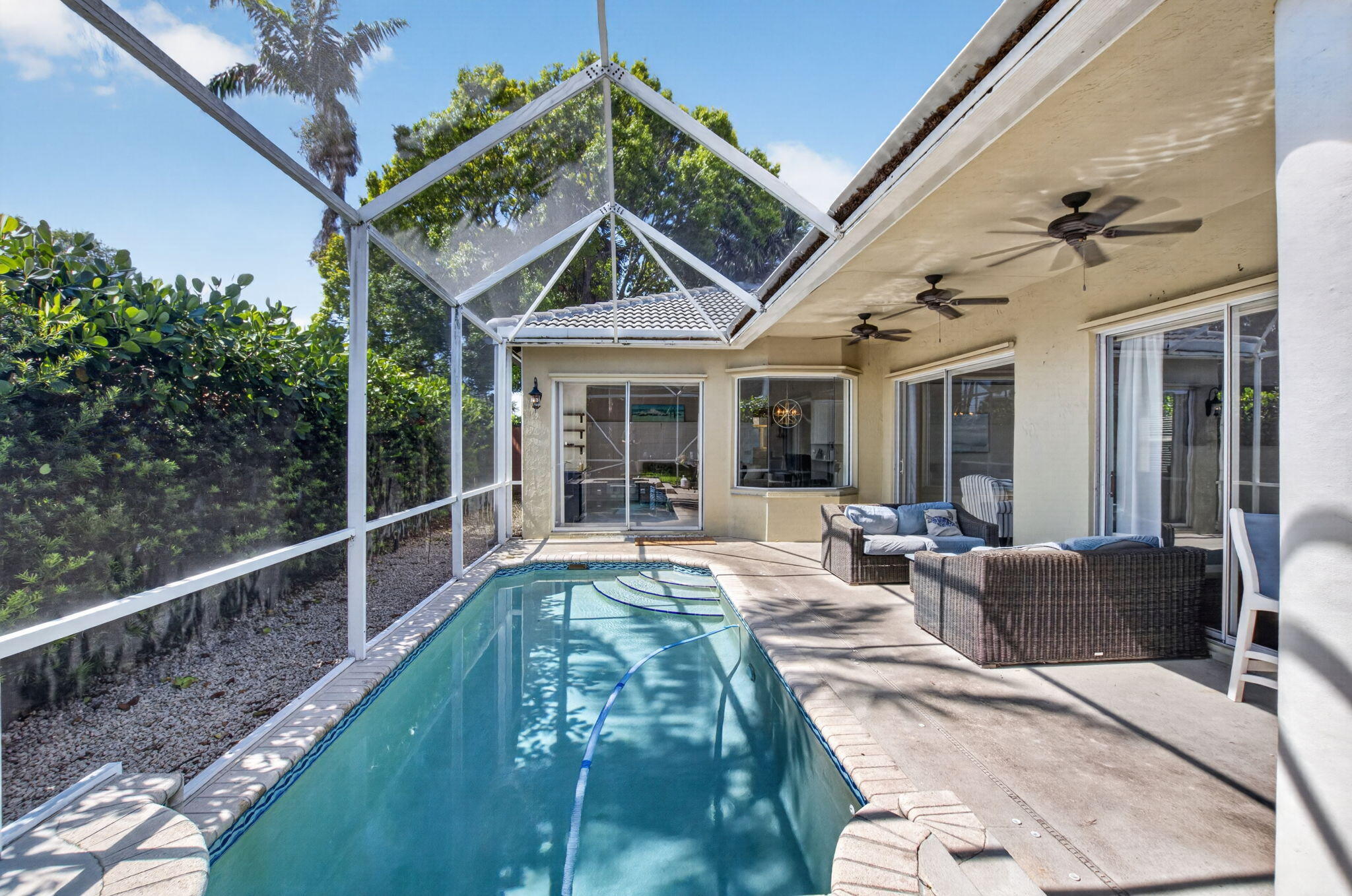 1365 East Barwick Ranch Circle Delray Beach, FL 33445 - Photo 56 of 77 a view of a house with backyard porch and sitting area