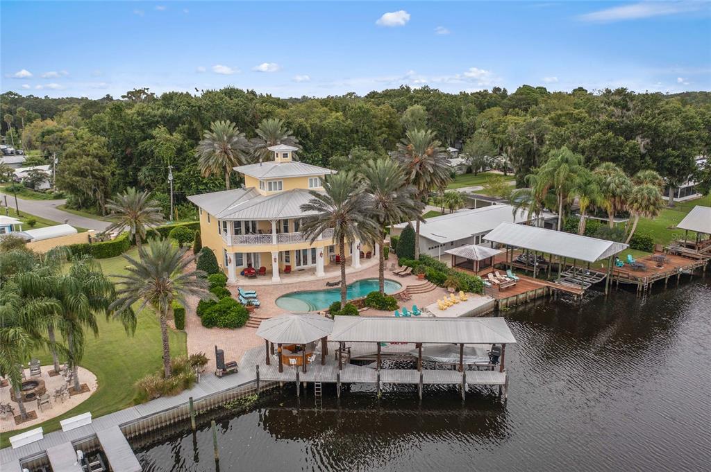 56230 Redbud Road Astor, FL 32102 - Photo 1 of 44 a view of a patio with furniture and a lake view