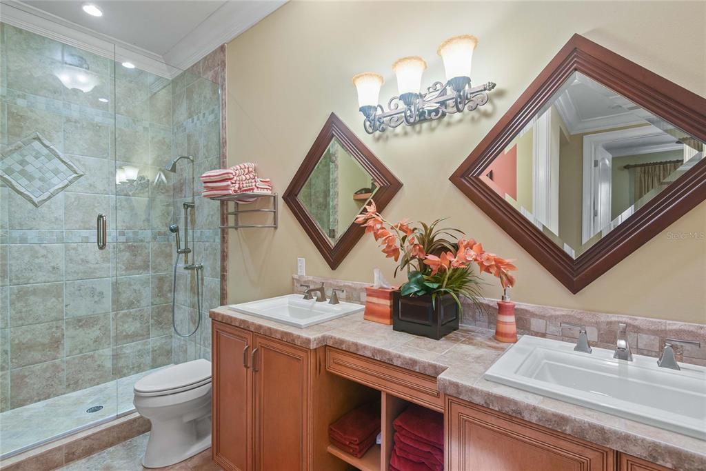 56230 Redbud Road Astor, FL 32102 - Photo 15 of 44 a bathroom with a granite countertop sink a toilet and a mirror
