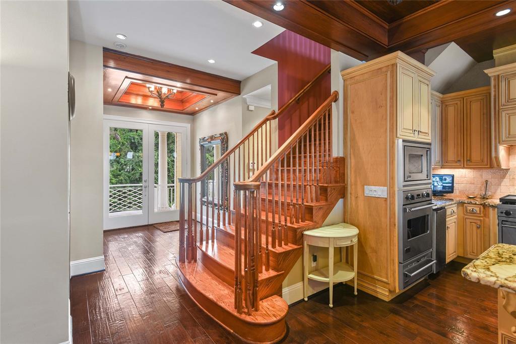 56230 Redbud Road Astor, FL 32102 - Photo 17 of 44 a view of entryway with wooden floor