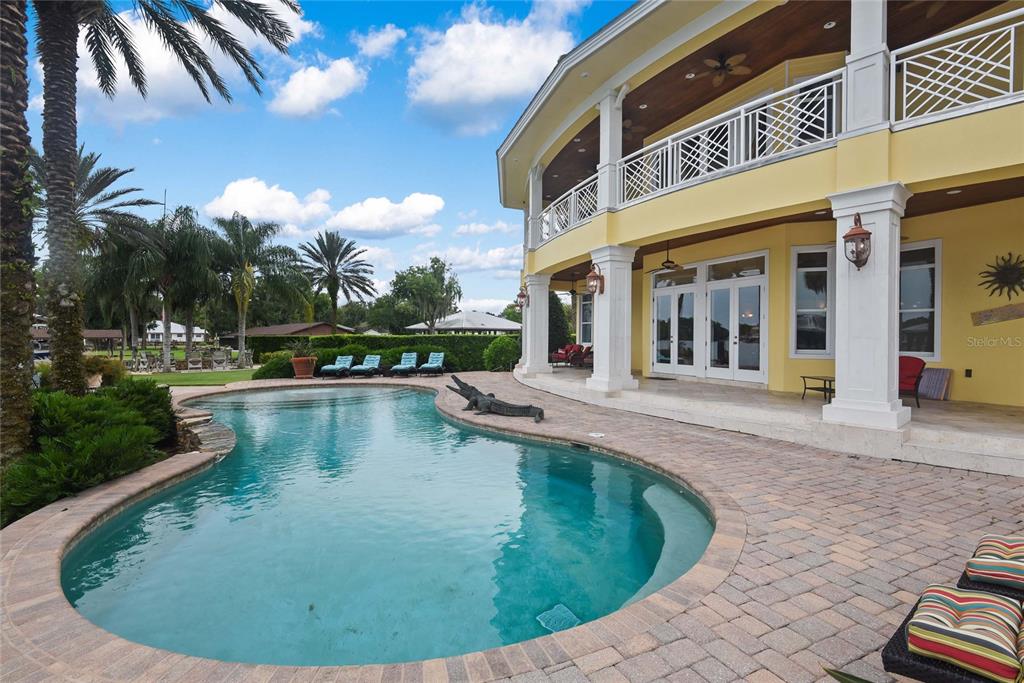 56230 Redbud Road Astor, FL 32102 - Photo 26 of 44 a view of a house with swimming pool