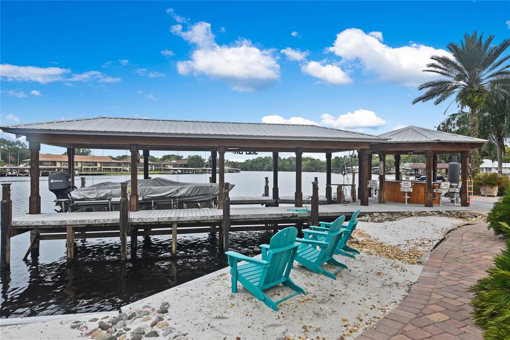 56230 Redbud Road Astor, FL 32102 - Photo 36 of 44 a view of a swimming pool with outdoor seating