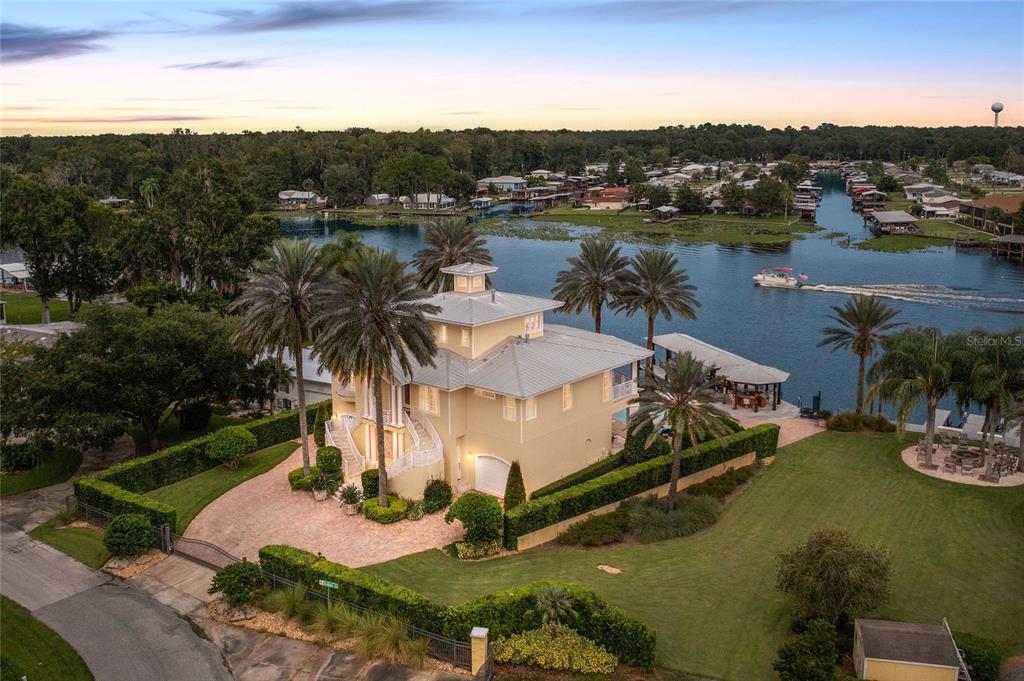 56230 Redbud Road Astor, FL 32102 - Photo 40 of 44 a view of a lake with a city