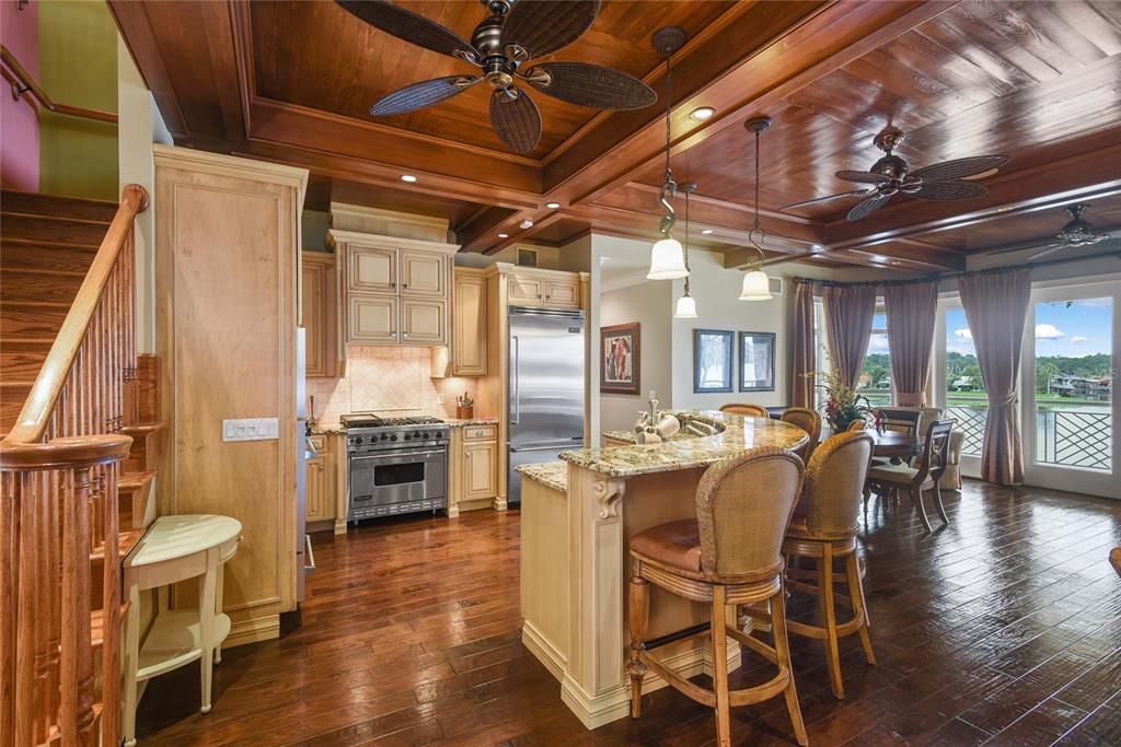 56230 Redbud Road Astor, FL 32102 - Photo 5 of 44 a dining hall with stainless steel appliances granite countertop a stove and cabinets