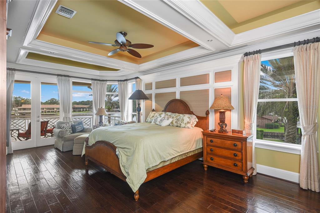 56230 Redbud Road Astor, FL 32102 - Photo 9 of 44 a bedroom with a bed and wooden floor