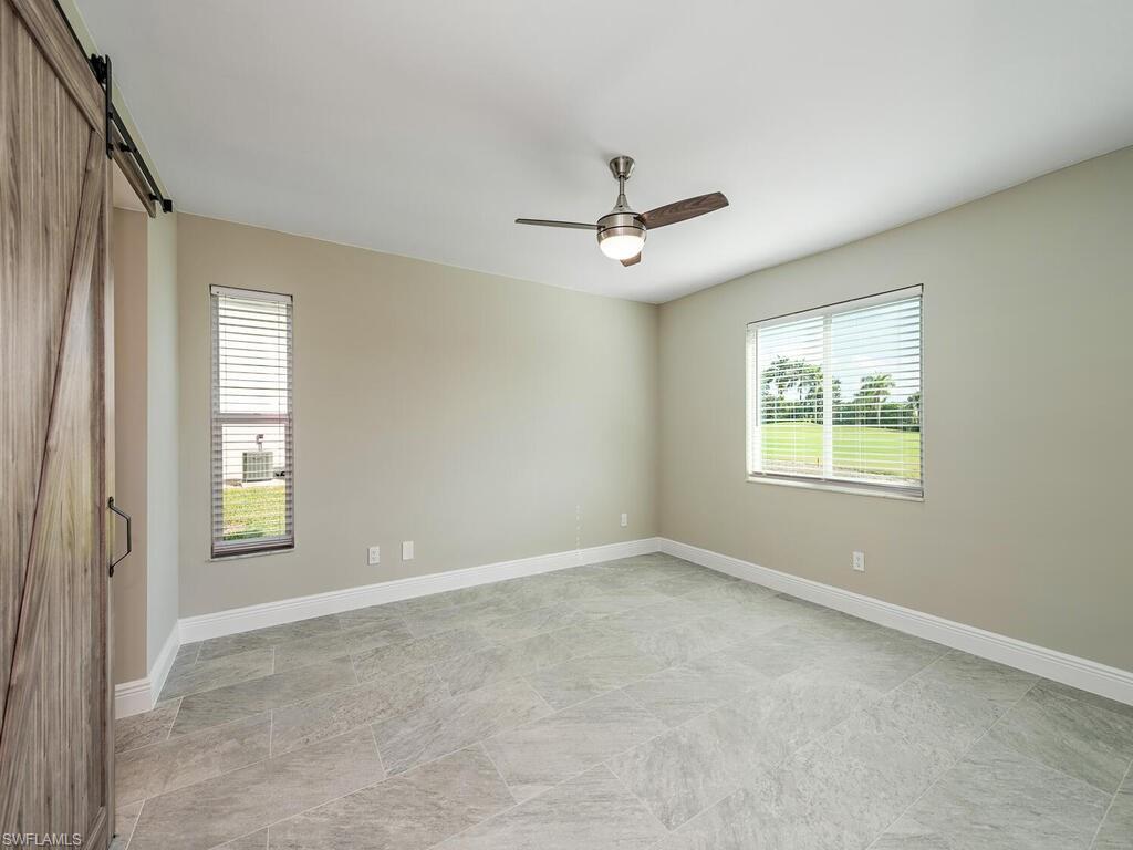 760 Augusta Boulevard, Unit D101 Naples, FL 34113 - Photo 7 of 13 a view of an empty room with a window
