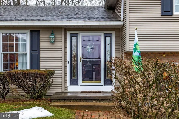 a view of entryway with wooden floor and stairs