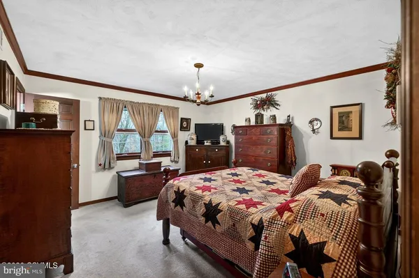 a bathroom with a sink toilet double vanity and shower