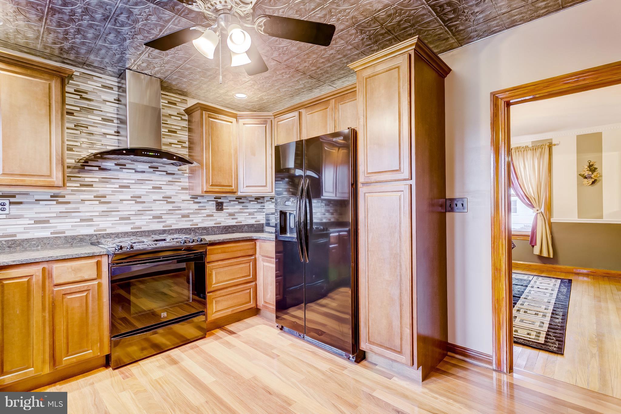 2602 Wentworth Road Baltimore, MD 21234 - Photo 5 of 28 Glass tile backsplash and Faux metal ceilings