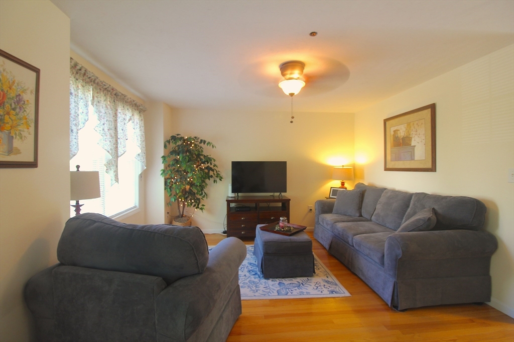 41 Boston Road, Unit 171 Billerica, MA 01862 - Photo 3 of 15 a living room with furniture and a flat screen tv