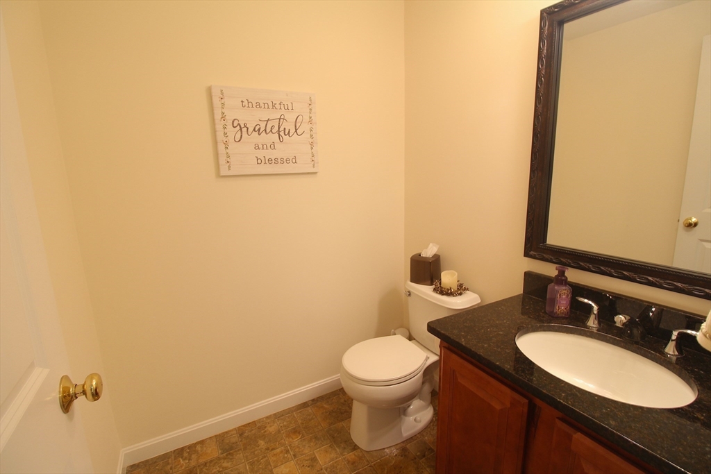 41 Boston Road, Unit 171 Billerica, MA 01862 - Photo 5 of 15 a bathroom with a toilet sink and mirror