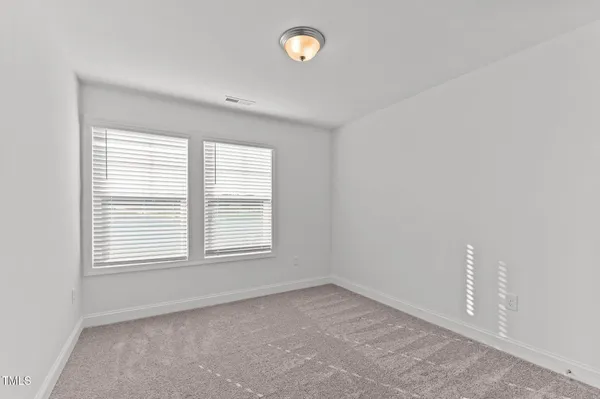 a bathroom with a bathtub shower sink vanity and toilet