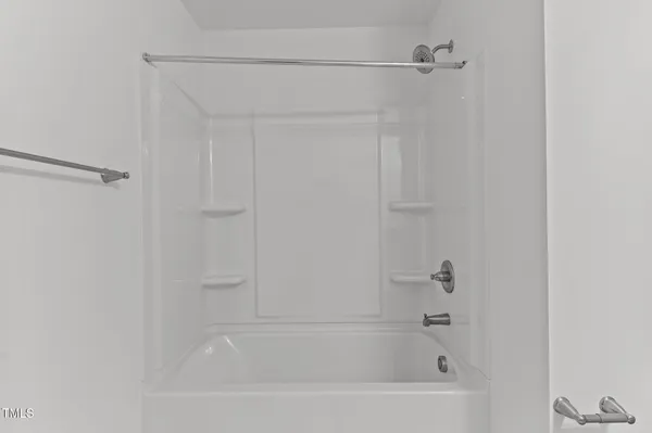 an empty room with a empty space and a window