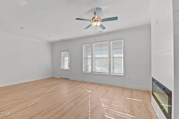 a view of an empty room with a window