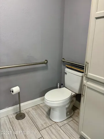 a bathroom with a toilet and a sink