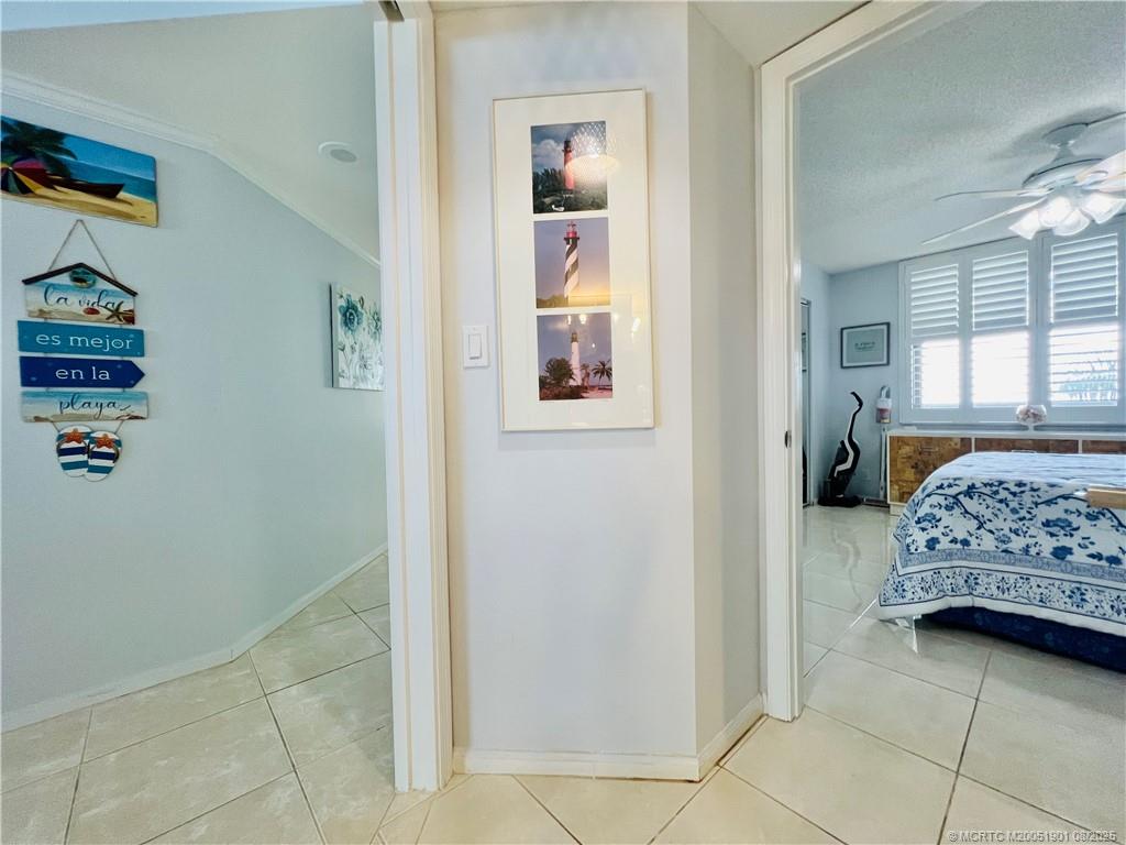9500 South Ocean Drive, Unit 809 Jensen Beach, FL 34957 - Photo 19 of 64 a bedroom with a bed and a window