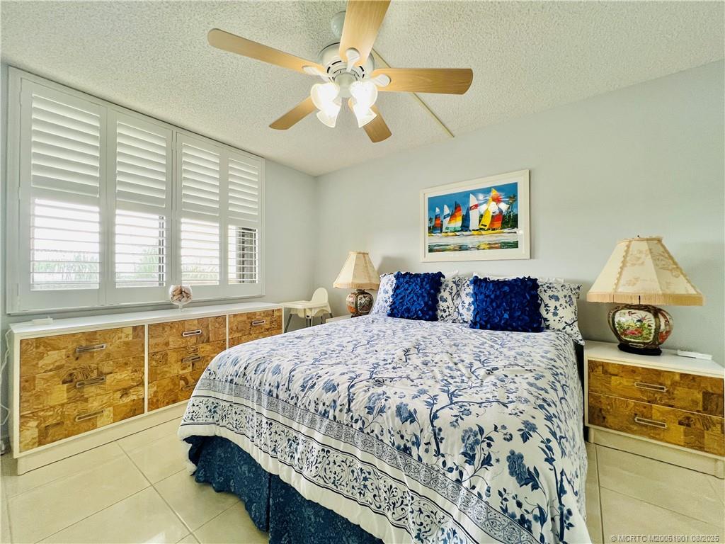 9500 South Ocean Drive, Unit 809 Jensen Beach, FL 34957 - Photo 20 of 64 a bedroom with a bed and a window