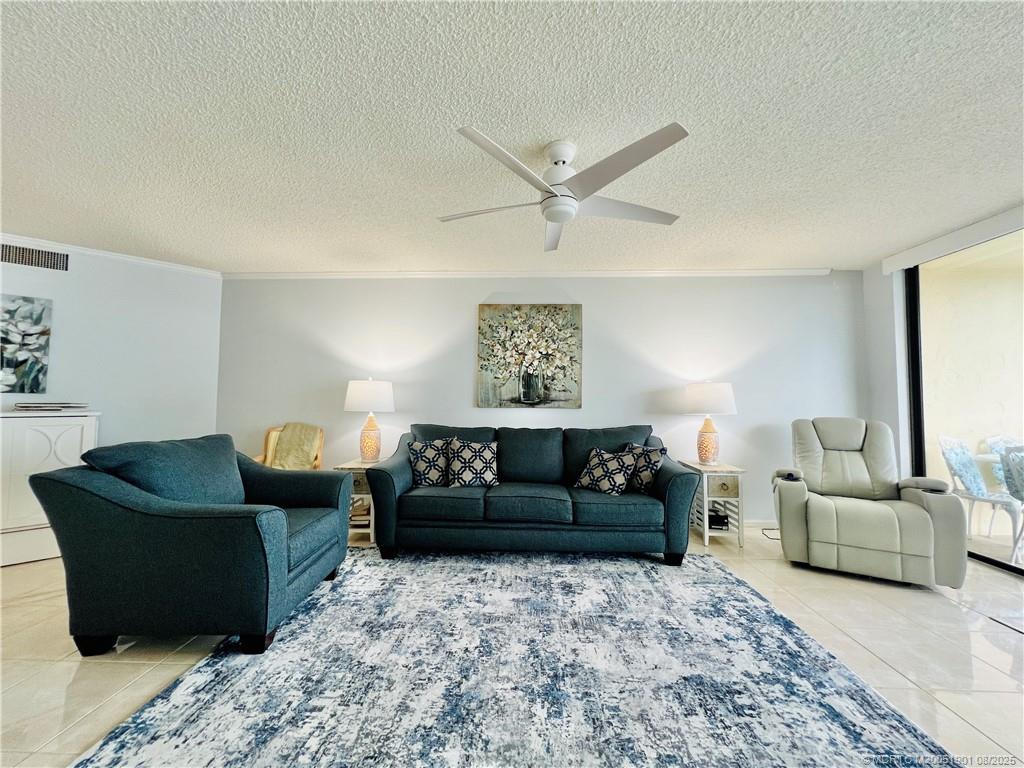 9500 South Ocean Drive, Unit 809 Jensen Beach, FL 34957 - Photo 30 of 64 a living room with furniture and a rug