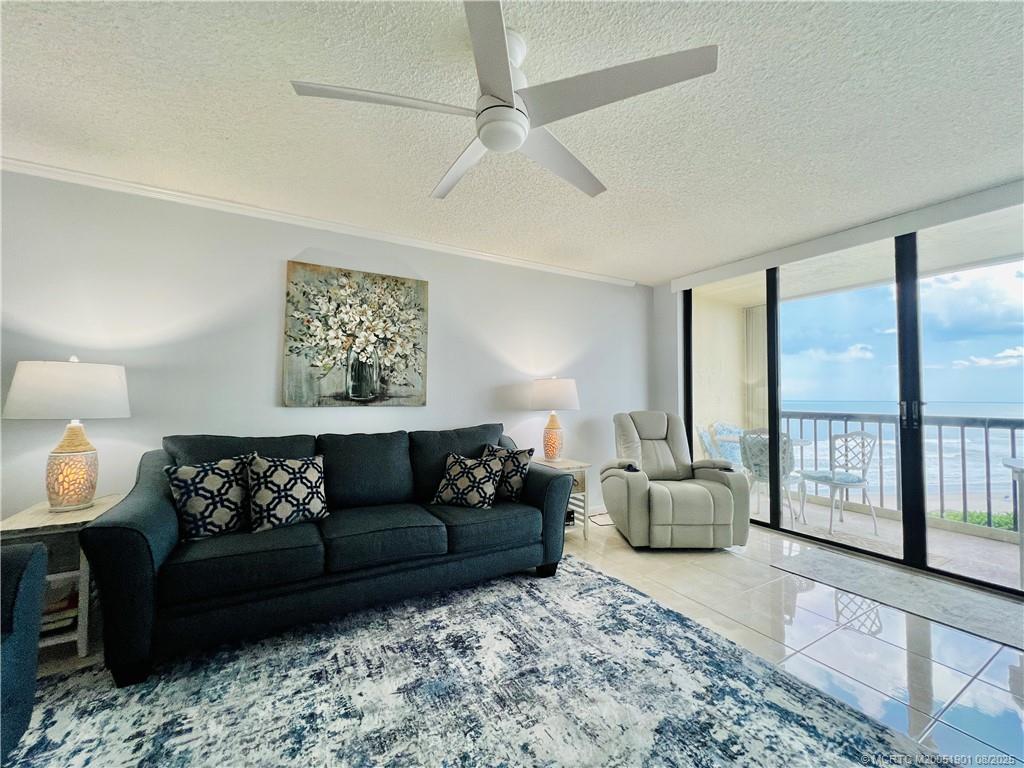 9500 South Ocean Drive, Unit 809 Jensen Beach, FL 34957 - Photo 32 of 64 a living room with furniture and a large window
