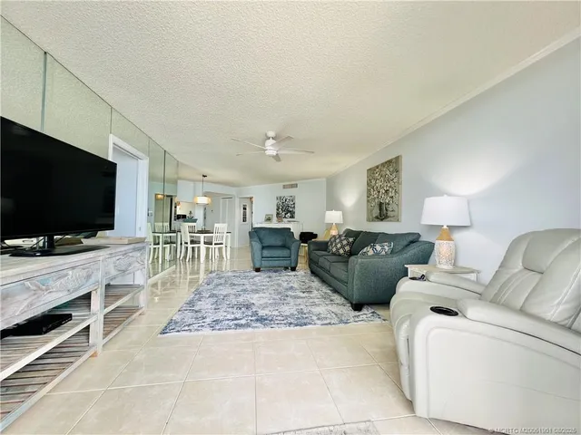 a spacious bedroom with a bed and a large window