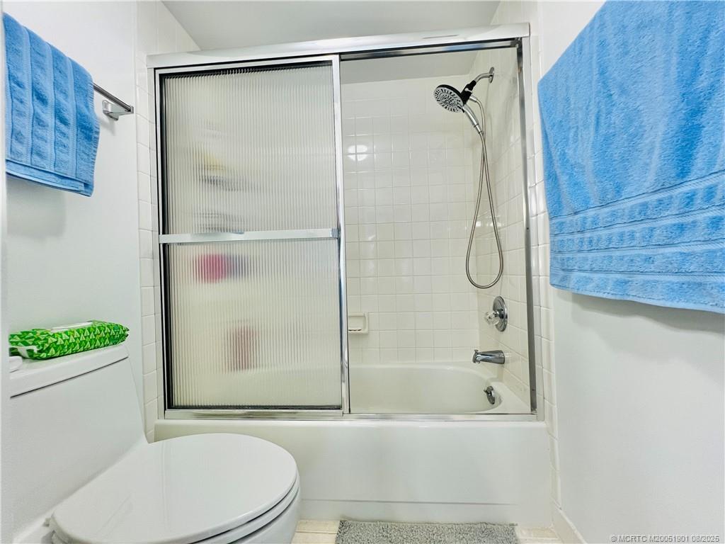 9500 South Ocean Drive, Unit 809 Jensen Beach, FL 34957 - Photo 53 of 64 a bathroom with a shower a toilet and a sink