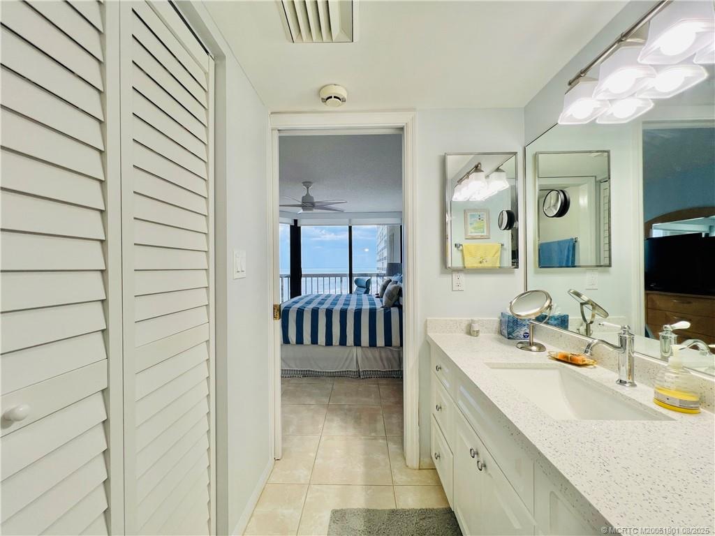 9500 South Ocean Drive, Unit 809 Jensen Beach, FL 34957 - Photo 55 of 64 a spacious bathroom with a double vanity sink and a mirror
