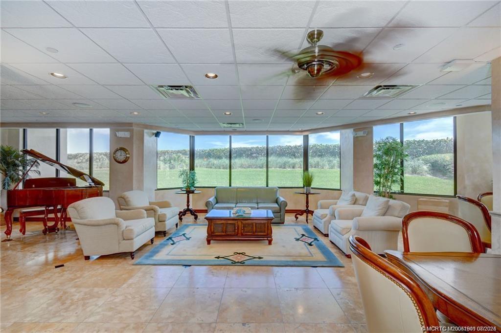 9500 South Ocean Drive, Unit 809 Jensen Beach, FL 34957 - Photo 62 of 64 a living room with furniture and a large window