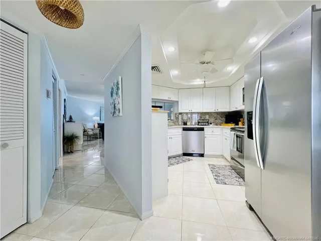 a kitchen with stainless steel appliances granite countertop a sink and stove top oven