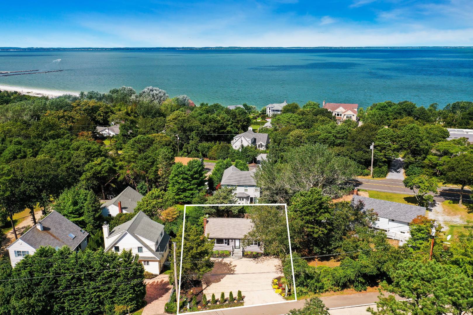 45 North Road Hampton Bays, NY 11946 - Photo 12 of 14 an aerial view of ocean with residential house and outdoor space