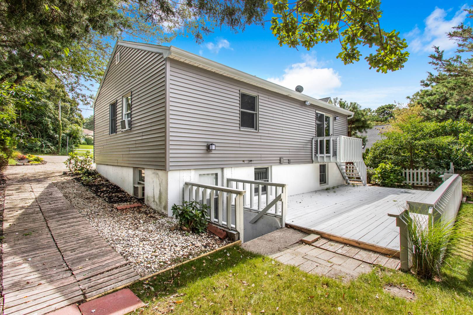 45 North Road Hampton Bays, NY 11946 - Photo 13 of 14 a view of a house with a patio