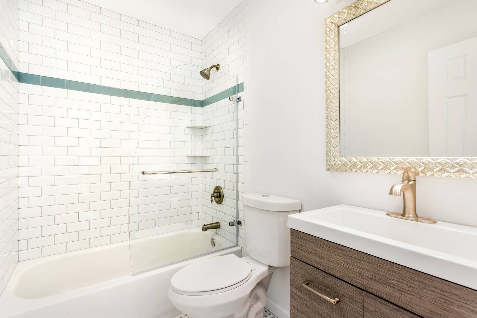 45 North Road Hampton Bays, NY 11946 - Photo 6 of 14 a bathroom with a sink a toilet and shower