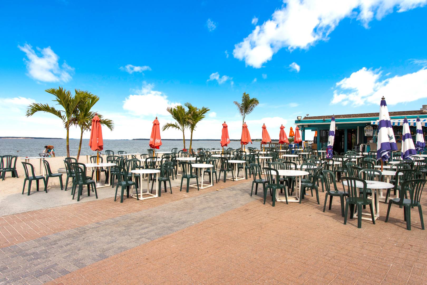45 North Road Hampton Bays, NY 11946 - Photo 10 of 14 a group of people sitting in a living room