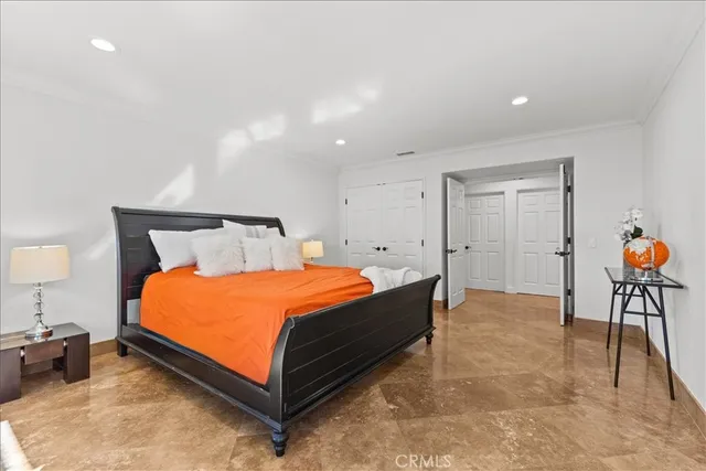 a bathroom with a sink and a large mirror next to a window