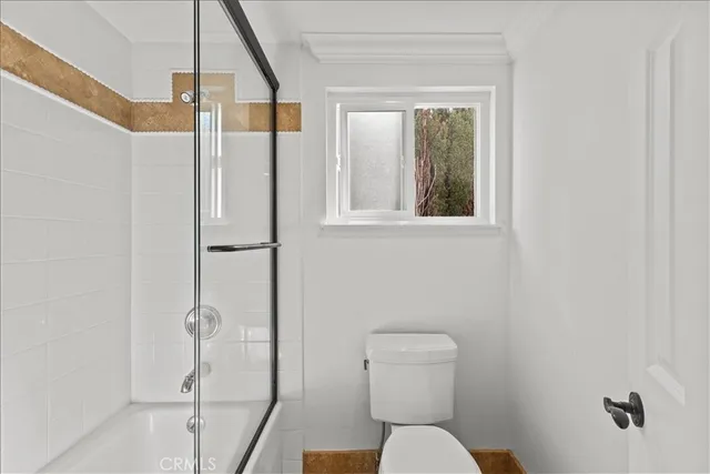 a front view of a house with swimming pool having outdoor seating